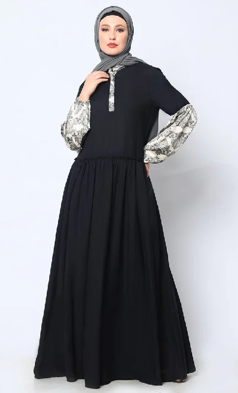 Fashionable Ease Mystic Bloom: Printed Black Abaya with Low Waist Gathers and Pockets Fashionable Ease Mystic Bloom: Printed Black Abaya with Low Waist Gathers and Pockets